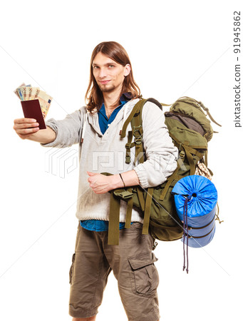 Man tourist backpacker holding money and passport. Man tourist backpacker holding money and passport. 91945862