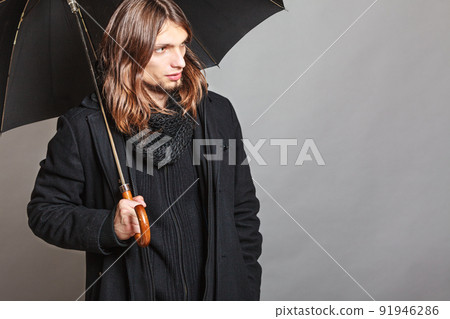 Handsome fashion man portrait wearing black coat. Handsome fashion man portrait wearing black coat. 91946286
