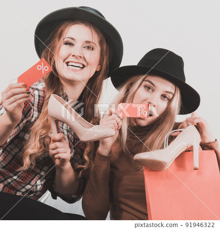 Two woman after sale shopping Two woman after sale shopping 91946322