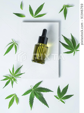 hemp cosmetic oil or serum, treatment for hair and scalp. Medical marijuana CBD oil and green leaf 91946769