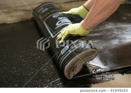 installation of waterproofing coating on the floor with a blowtorch and resin. 91949283