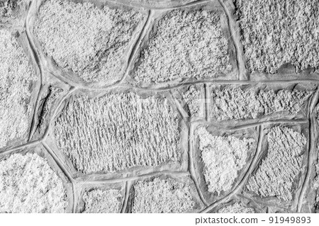 Grey stone wall for background design. Backdrop from old stones with concrete seams. Natural stone wall textured background for a poster, calendar, screensaver, wallpaper, postcard, banner, cover 91949893