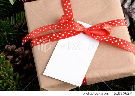 Christmas rectangle gift tag mockup with present box, product label mockup, with natural fir tree branch, name tag Christmas rectangle gift tag mockup with present box, product label mockup, with natural fir tree branch, name tag 91950627