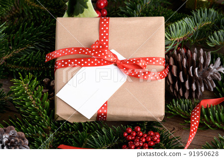 Christmas rectangle gift tag mockup with present box, product label mockup, with natural fir tree branch, name tag Christmas rectangle gift tag mockup with present box, product label mockup, with natural fir tree branch, name tag 91950628
