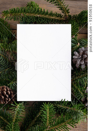 Christmas 5x7 card mockup template with fir twigs on wooden background. Design element for Christmas and New Year Christmas 5x7 card mockup template with fir twigs on wooden background. Design element for Christmas and New Year 91950658