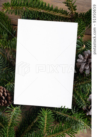 Christmas 5x7 card mockup template with fir twigs on wooden background. Design element for Christmas and New Year Christmas 5x7 card mockup template with fir twigs on wooden background. Design element for Christmas and New Year 91950659