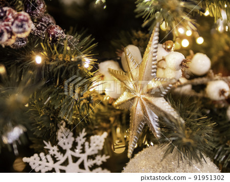 Christmas tree with shiny decorations. Fir tree decorated with light bulbs and star for New Year celebration. Christmas tree with shiny decorations. Fir tree decorated with light bulbs and star for New Year celebration. 91951302