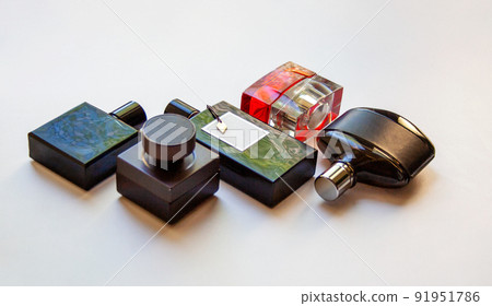 Five glass perfume bottles isolated on white background Five glass perfume bottles isolated on white background 91951786
