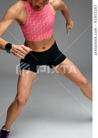 Fitness woman jumping and running, working out. Athletic girl doing jump Fitness woman jumping and running, working out. Athletic girl doing jump 91953267