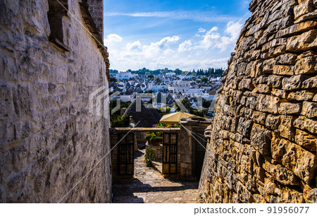 Famous Trulli houses in the city of Alberobello in Italy 91956077