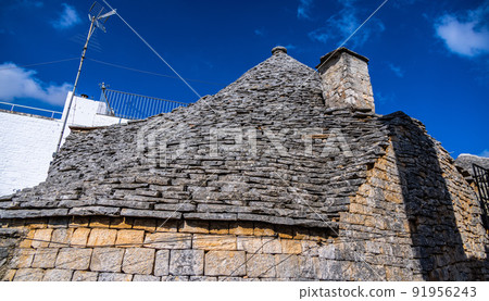 Historic Trulli houses in the city of Alberobello in Italy - a tourist attraction 91956243