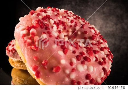 Strawberry sugar doughnuts in close-up view - macro shot Strawberry sugar doughnuts in close-up view - macro shot 91956458