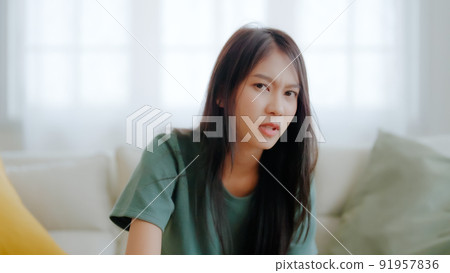 Upset asian woman frustrated by problem with work or relationships 91957836