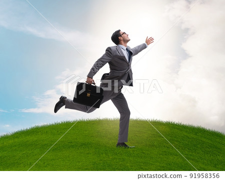 Happy businessman running towards his goal Happy businessman running towards his goal 91958356