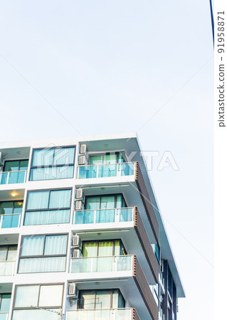 Modern real estate condominium building with blue window Modern real estate condominium building with blue window 91958871