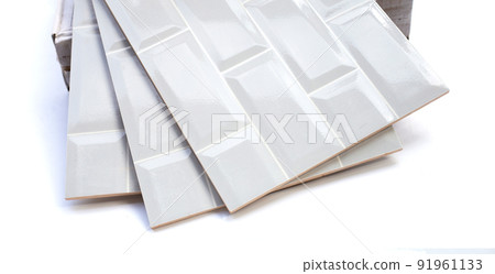 Pile of wall tiles on white background. 91961133
