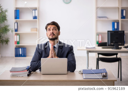 Young male employee working in the office 91962189