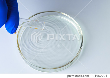 Close up of hands of a scientist working with laboratory samples 91962221