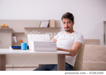 Young male freelancer working from home 91962890