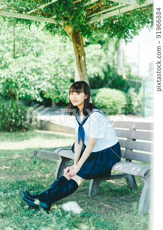 High school girl sitting on the bench 91966884