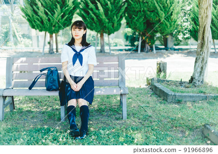 High school girl sitting on the bench 91966896