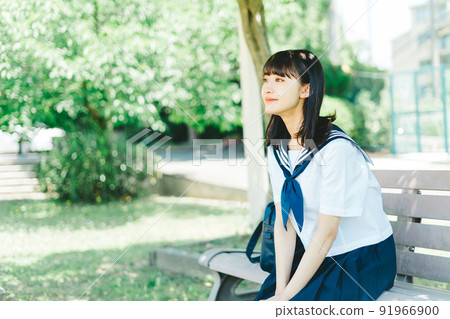 High school girl sitting on the bench High school girl sitting on the bench 91966900