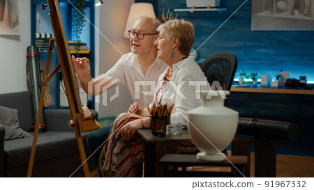 Retired man and woman doing teamwork to draw vase model with artistic skills and professional tools. Drawing artwork masterpiece with inspiration design and creativity, sketch. Retired man and woman doing teamwork to draw vase model with artistic skills and professional tools. Drawing artwork masterpiece with inspiration design and creativity, sketch. 91967332