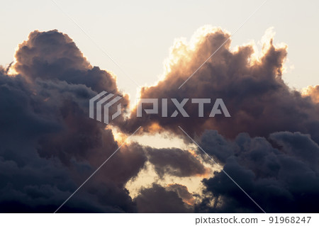 The puffy clouds seen in the twilight rising The puffy clouds seen in the twilight rising 91968247