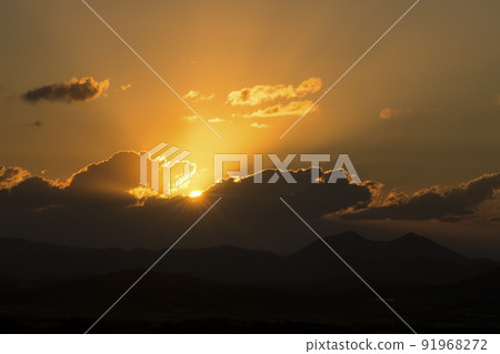 sun setting in the clouds sun setting in the clouds 91968272