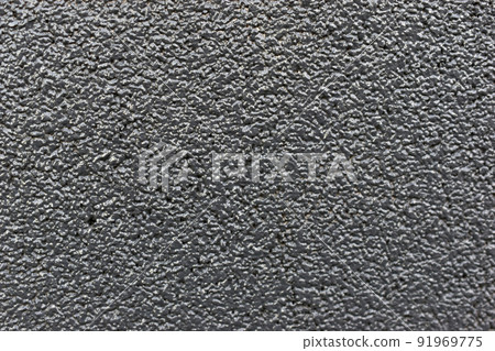 Painted gray speckled wall with pebbles Painted gray speckled wall with pebbles 91969775