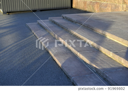Stone stairs on the street in the evening 91969802