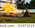 Firefighter with fire and suit for protect fire fighter for training firefighters. 91971019