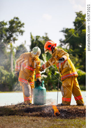 Firefighter with fire and suit for protect fire fighter for training firefighters. 91971021