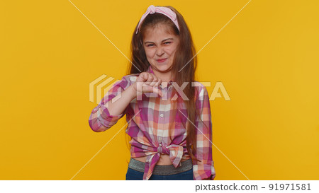 Upset preteen child girl showing thumbs down, dislike bad work, disapproval, dissatisfied feedback Upset preteen child girl showing thumbs down, dislike bad work, disapproval, dissatisfied feedback 91971581