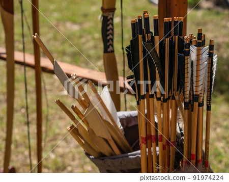 close-up shot medieval bow arrow feathers historical close-up shot medieval bow arrow feathers historical 91974224