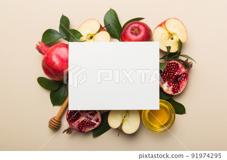 Flat lay composition with Blank flyer poster and symbols jewish Rosh Hashanah holiday attributes on colored background, New Year holiday Traditional. Top view with copy space mock up Flat lay composition with Blank flyer poster and symbols jewish Rosh Hashanah holiday attributes on colored background, New Year holiday Traditional. Top view with copy space mock up 91974295