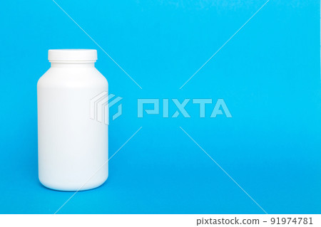 supplement pills with medicine bottle health care and medical top view. Vitamin tablets. Top view mockup bottle for pills and vitamins with green leaves, natural organic bio supplement, copy space 91974781