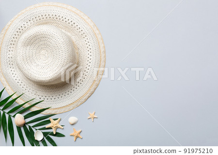 Summer holidays. Summer concept with straw hat and tropical leaf. Flat lay, top view, copy space Summer holidays. Summer concept with straw hat and tropical leaf. Flat lay, top view, copy space 91975210