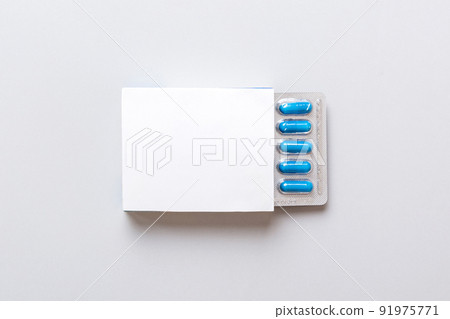 Blank White Product Package Box Mock-up. Open blank medicine drug box with blue pills blister top view Blank White Product Package Box Mock-up. Open blank medicine drug box with blue pills blister top view 91975771