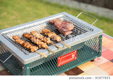 Baking steak and yakitori on BBQ Baking steak and yakitori on BBQ 91977855