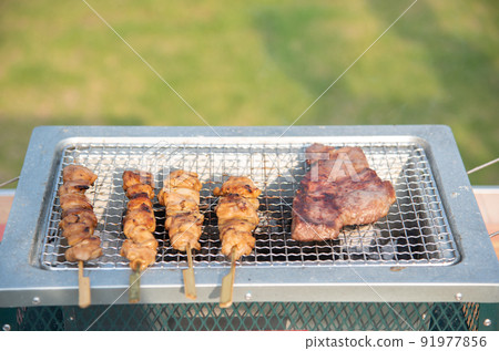 Baking steak and yakitori on BBQ Baking steak and yakitori on BBQ 91977856