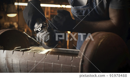 Sparks from metal grinding grill in equipped garage Sparks from metal grinding grill in equipped garage 91978488