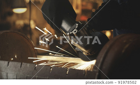 Man with circular saw for metalworking Man with circular saw for metalworking 91978502