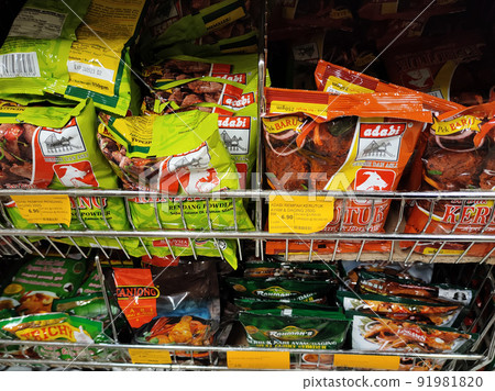 SELANGOR, MALAYSIA -JULY 3, 2021: Selective focused on various types of spice powders that have been packed in commercial packs. Sorted by brand and type. Labeled with a price tag. SELANGOR, MALAYSIA -JULY 3, 2021: Selective focused on various types of spice powders that have been packed in commercial packs. Sorted by brand and type. Labeled with a price tag. 91981820
