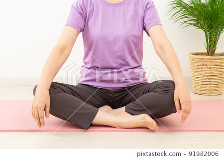 Middle woman stretching indoors 91982006