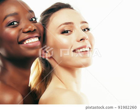 different nation woman: african-american and caucasian together isolated on white background happy smiling, diverse type on skin, lifestyle people concept close up 91982260