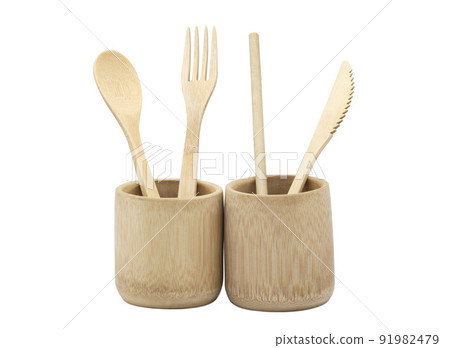 Bamboo wood cutlery, disposable fork, spoon,knife and straw in bamboo cup made of natural material isolated on white background. Ecological concept. 91982479