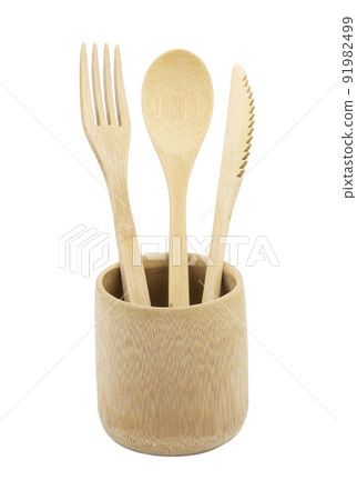 Bamboo wood cutlery, disposable fork, spoon,knife in bamboo cup made of natural material isolated on white background. Ecological concept. 91982499