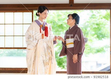 Shiromuku bride and senior in kimono Shiromuku bride and senior in kimono 91982518