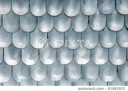 Close-up detail metallic texture pattern matte medieval replica steel chain mail scales plates knight armor. Old ancient iron metal body armour protection. Abstract chainmale dragon skin background Close-up detail metallic texture pattern matte medieval replica steel chain mail scales plates knight armor. Old ancient iron metal body armour protection. Abstract chainmale dragon skin background 91982923